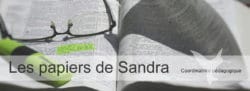 Lunettes posées sur un journal